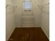 A walk-in closet with shelving and a window for natural lighting at 8250 N Grand Canyon Dr # 2085, Las Vegas, NV 89166