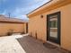 Private backyard area with black door and a paved patio at 8348 Nelson Ridge Ln, Las Vegas, NV 89178