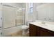 Bright bathroom featuring a shower over tub and vanity with white countertop at 8348 Nelson Ridge Ln, Las Vegas, NV 89178