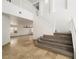 Open foyer featuring a staircase, tile flooring, and view to the living area at 8348 Nelson Ridge Ln, Las Vegas, NV 89178