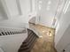 Bright foyer with high ceilings, chandelier, light tile floors and overlooking staircase at 8348 Nelson Ridge Ln, Las Vegas, NV 89178