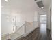 Bright upstairs hallway with wood floors and large windows overlooking a spacious foyer at 8348 Nelson Ridge Ln, Las Vegas, NV 89178