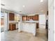 Kitchen with stainless appliances, tile floors, granite counters, and sliding door access to backyard at 8348 Nelson Ridge Ln, Las Vegas, NV 89178