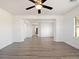 Spacious living room featuring hardwood floors, neutral walls, and recessed lighting at 8348 Nelson Ridge Ln, Las Vegas, NV 89178