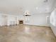 Spacious living room with a fireplace, tile flooring, and modern ceiling fan at 8348 Nelson Ridge Ln, Las Vegas, NV 89178