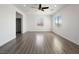 Large living room with hardwood floors, neutral walls, and recessed lighting at 8348 Nelson Ridge Ln, Las Vegas, NV 89178