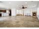 Open living space with tile flooring, fireplace, and view to the kitchen at 8348 Nelson Ridge Ln, Las Vegas, NV 89178