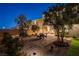 Backyard provides a spacious patio area with dining, desert landscaping, and artificial grass at 10172 Bismarck Palms Ave, Las Vegas, NV 89166