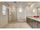 Bright bathroom with a soaking tub, walk-in shower, double vanity, and modern finishes at 10172 Bismarck Palms Ave, Las Vegas, NV 89166