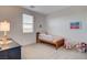 Charming bedroom with neutral walls, plush carpet, and a cute rocking horse toy at 10172 Bismarck Palms Ave, Las Vegas, NV 89166