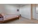 Cozy bedroom boasts a bed, closet, and minimalist decor at 10172 Bismarck Palms Ave, Las Vegas, NV 89166