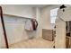 Walk-in closet with organization system and natural light from a window at 10172 Bismarck Palms Ave, Las Vegas, NV 89166