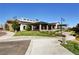 Community clubhouse with a covered outdoor seating area and landscaped grounds, perfect for social gatherings at 10172 Bismarck Palms Ave, Las Vegas, NV 89166