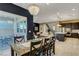 An open concept design with views of dining area, living room, and kitchen at 10172 Bismarck Palms Ave, Las Vegas, NV 89166