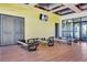 Bright fitness center featuring pilates reformers, wood-look floors, and television for an enjoyable workout experience at 10172 Bismarck Palms Ave, Las Vegas, NV 89166