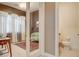 Stylish office area featuring glass French doors, desk, and a compact half bathroom at 10172 Bismarck Palms Ave, Las Vegas, NV 89166