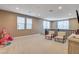Generous play room features windows, comfy chairs, and toys at 10172 Bismarck Palms Ave, Las Vegas, NV 89166