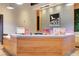 Lobby featuring a wooden reception desk with modern design, clean lines, and a welcoming atmosphere at 10172 Bismarck Palms Ave, Las Vegas, NV 89166