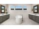 Luxurious bathroom with freestanding tub, double vanities, and modern fixtures at 10655 Patina Hills Ct, Las Vegas, NV 89135