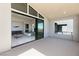 Primary bedroom suite with sliding glass doors leading to a private balcony at 10655 Patina Hills Ct, Las Vegas, NV 89135