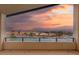 Balcony offering picturesque sunset views overlooking the neighborhood at 10655 Patina Hills Ct, Las Vegas, NV 89135
