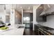 Modern kitchen boasts stainless appliances, sleek cabinetry, and a spacious center island for food preparation at 10655 Patina Hills Ct, Las Vegas, NV 89135