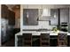 Stylish kitchen with stainless steel appliances, a center island with seating, and abundant cabinet space at 10655 Patina Hills Ct, Las Vegas, NV 89135
