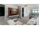 Stylish upstairs living area with built-in shelves, comfortable seating, and bright windows at 10655 Patina Hills Ct, Las Vegas, NV 89135