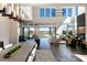 Sun-filled living area boasts high ceilings, modern lighting, and a fluid transition to outdoor living space at 10655 Patina Hills Ct, Las Vegas, NV 89135
