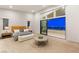 Bright main bedroom boasts carpet, large windows, and sliding door access to balcony with city views at 10655 Patina Hills Ct, Las Vegas, NV 89135