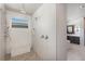 Modern walk-in shower with multiple showerheads, pebble flooring, and built-in bench at 10655 Patina Hills Ct, Las Vegas, NV 89135