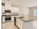 Well-equipped kitchen with granite countertops, stainless steel appliances, and a functional center island at 10748 Wild Poppy Ave, Las Vegas, NV 89129