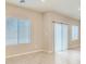 Bright living room featuring modern windows and neutral finishes, perfect for relaxation and entertaining at 10748 Wild Poppy Ave, Las Vegas, NV 89129