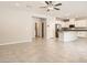 Open concept living room with access to the kitchen and lots of natural light at 10748 Wild Poppy Ave, Las Vegas, NV 89129