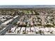 A high-angle shot displays a community near a golf course, offering a blend of leisure and residential living at 1713 Diamond Oaks Ct, Las Vegas, NV 89117
