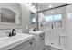 Bathroom with double vanity sinks, stylish fixtures, and modern glass shower; a serene space at 1713 Diamond Oaks Ct, Las Vegas, NV 89117