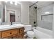 Charming bathroom featuring updated fixtures, a shower-tub combo, and tiled accents at 1713 Diamond Oaks Ct, Las Vegas, NV 89117