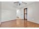 Inviting bedroom with a ceiling fan, hardwood floors, and a closet at 1713 Diamond Oaks Ct, Las Vegas, NV 89117