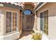 The home's front entrance features a decorative security door and a stone facade at 1713 Diamond Oaks Ct, Las Vegas, NV 89117