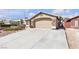 Charming home featuring a stone facade, two-car garage, and drought resistant landscaping at 1713 Diamond Oaks Ct, Las Vegas, NV 89117