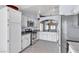 Bright kitchen featuring white cabinetry and stainless steel appliances at 1713 Diamond Oaks Ct, Las Vegas, NV 89117