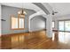 Spacious living room featuring hardwood floors, a chandelier, and lots of natural light at 1713 Diamond Oaks Ct, Las Vegas, NV 89117
