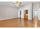 Large main bedroom featuring wood-look floors, vaulted ceiling, walk-in closet, and neutral paint at 1713 Diamond Oaks Ct, Las Vegas, NV 89117