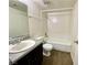 Standard bathroom with shower-tub combo and single sink vanity, with wood-look flooring at 1912 Nebula Dr, Las Vegas, NV 89115
