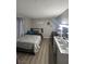 Cozy bedroom featuring a well-lit vanity, plush bed, and neutral decor creating a comfortable space at 1912 Nebula Dr, Las Vegas, NV 89115