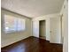 This bedroom features wood floors, closet, and a window to let the sunshine in at 1912 Nebula Dr, Las Vegas, NV 89115