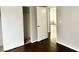 Bedroom with closet and dark wood-look floors, bathed in natural light at 1912 Nebula Dr, Las Vegas, NV 89115