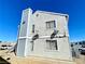 Three-story apartments showing a combination of stucco and siding exteriors, under a bright blue sky at 1912 Nebula Dr, Las Vegas, NV 89115