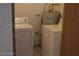 Efficient laundry room with washer, dryer, and water heater, perfect for convenient chores at 1912 Nebula Dr, Las Vegas, NV 89115