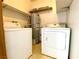 Convenient laundry room equipped with washer, dryer, and shelving at 1912 Nebula Dr, Las Vegas, NV 89115
